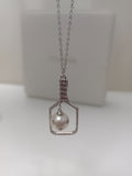 Silver pickleball pendant with pearl and chain